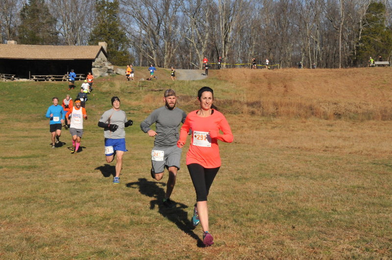 Runners crossing Michigan Road campground area.