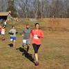 Runners crossing Michigan Road campground area.