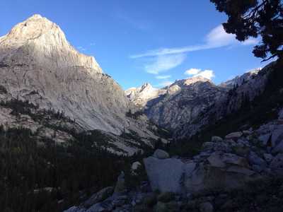 A view of the sun rising over LeConte Canyon, with Langille Peak in the foreground on the left.