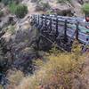 A trail crew crosses over Mule Creek.