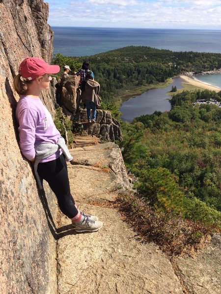 Enjoying the stunning view from one of the narrower ledges of the Beehive Trail.