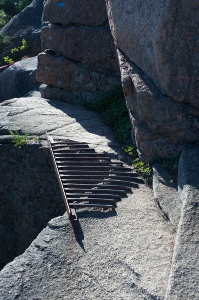 Metal grating that makes up part of the trail that you climb.