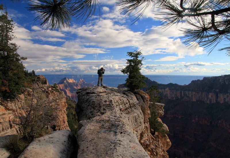 Out on a North Rim Ledge taking some photos. Picture by Jim McNutt