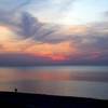 A couple enjoying the incredible colors of the Lake Michigan sunset.