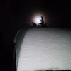 A full moon peeps out over a lean-to on an evening hike to Mt. Kit Carson.