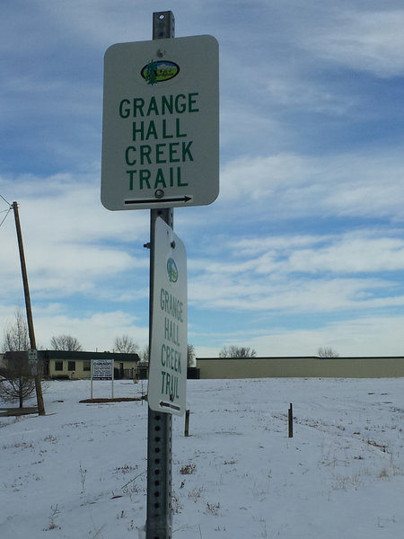 The first sign showing how to get to trail, not far from parking lot, just after crossing the street.