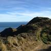 Overlooking the path in front of me with the ocean and the South Island in the background.