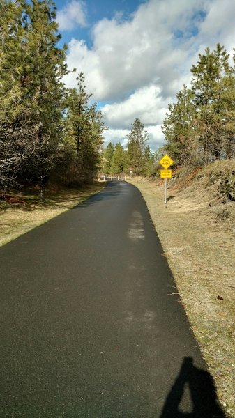 Approaching one of two marked road crossings on this section of the Fish Lake Trail.