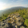 The view south towards Katahdin from the top of Black Cat Mtn. When you get to this point, hang to the right treeline and keep looking right as the trail will dip down this way.