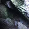 Looking down into the cave.   It's a tight squeeze, but it's worth exploring.  Make sure you have a flashlight as there are areas where there is no light.