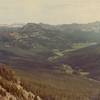 From Bliss Pass the rare beauty of Upper Pebble Creek spreads out at your feet. Beyond the park boundary the granite peaks of the snowy Beartooth Mountains loom in the distance.