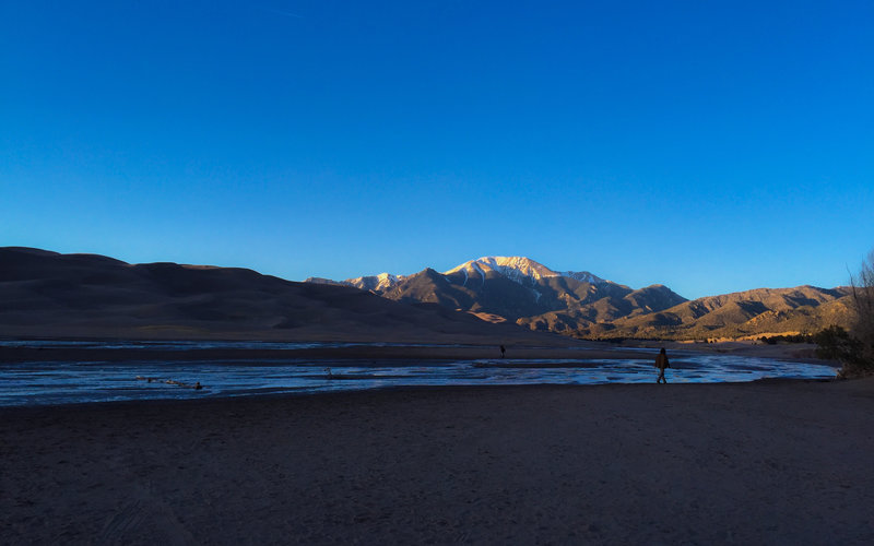 Views of sand peaks and mountain peaks abound in Great Sand Dunes National Park.