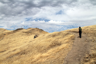 Hiking the ridgeline with big sky views.