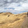 Hiking the ridgeline with big sky views.