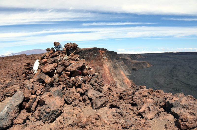 The Summit Cairn on Mauna Loa. An outline of distant Mauna Kea on the left horizon. with permission from Andrew Stehlik