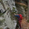 Looking for chutes to climb in order to ascend the cliffs up to the summit of Friday. No ice on the south facing side!