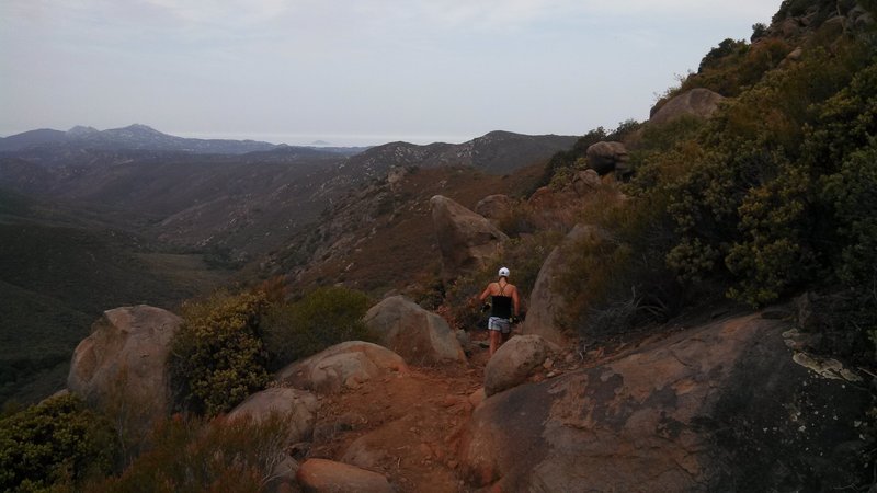 Running along the rim of the canyon on the north side, just before dropping down the switchbacks.