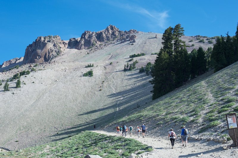 The Lassen Peak Trail as it leaves the parking lot. The trail switchbacks and starts climbing more steeply after the first turn.