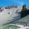 The Lassen Peak Trail as it leaves the parking lot. The trail switchbacks and starts climbing more steeply after the first turn.