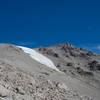 Snow clings to the mountain around the peak late into the summer.