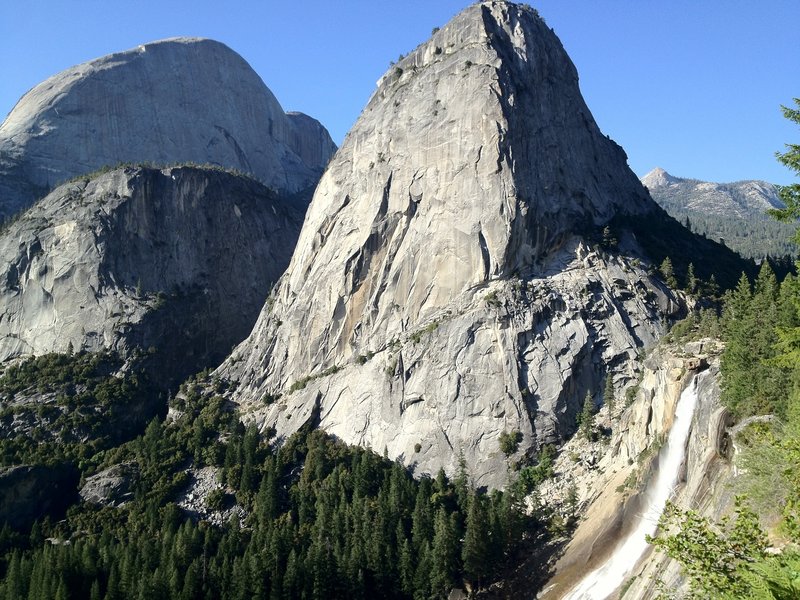 Nevada Falls and Liberty Cap loom over the trail.