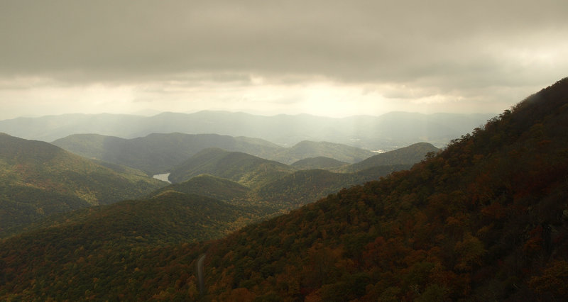 Sunlight filtering through clouds over Asheville, as seen from the Mountains-to-Sea Trail. Photo by Matt Mutel.