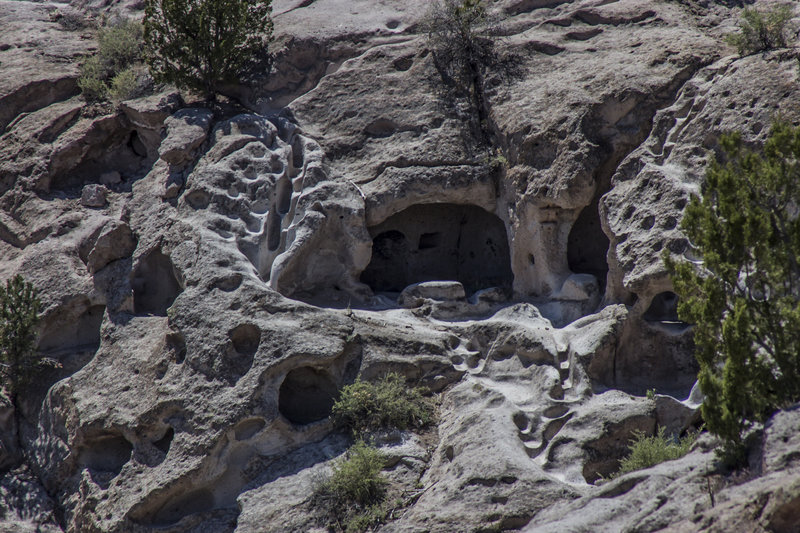 Often known as cliff dwellings, a cavate is a natural cave that has been enlarged or modified by humans. The soft rock found on the Pajarito Plateau made an ideal place for the Ancestral Pueblo people to thrive. Here, a cavate is surrounded by staircases and walkways carved out by footsteps.