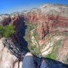 Legs dangling over the Angels Landing precipice.