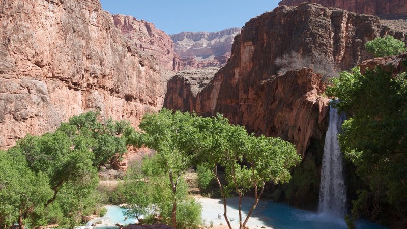 Havasu Falls, a 100-foot waterfall in between Supai and the Havasupai Campground.