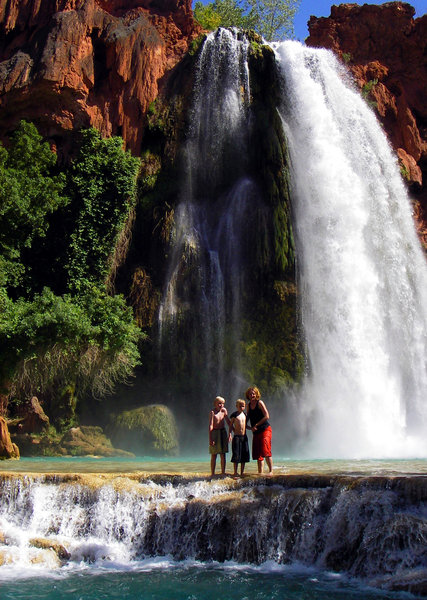 Visitors posing in front of Havasupai Falls.