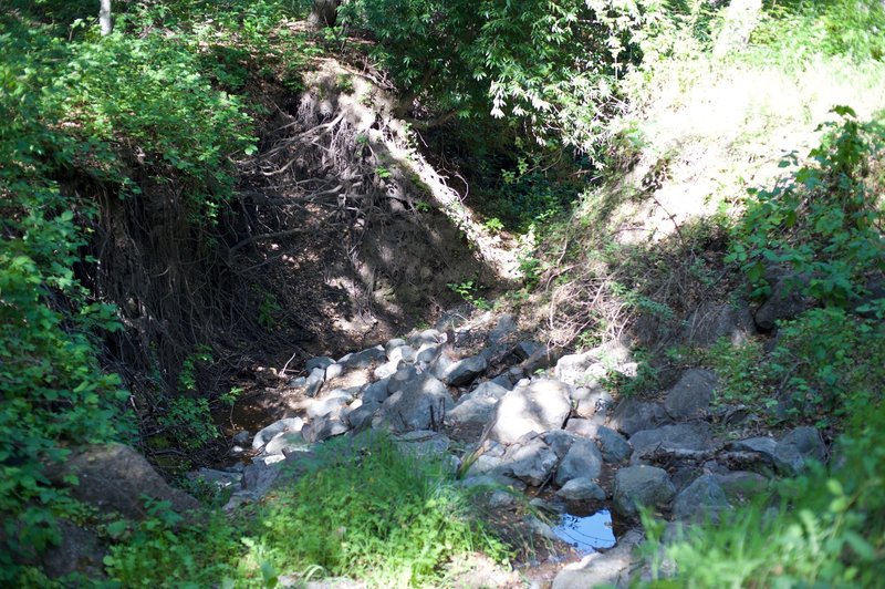 The dry creek bed that the trail crosses.