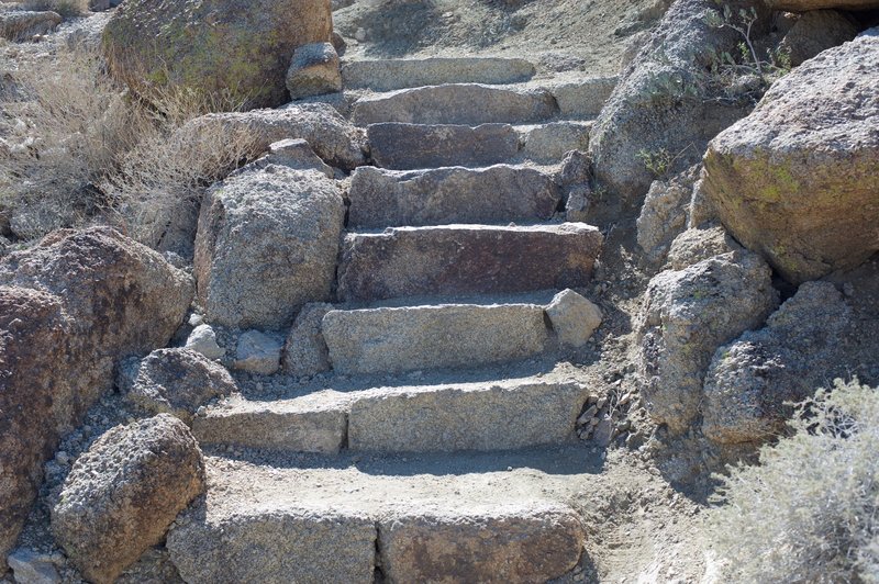 Stairs help climb steeper portions of the trail on the ascent.