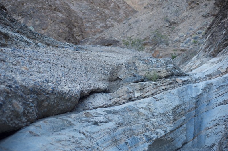 You have to scramble up this 5-6 foot rock scramble.  If you have poles, you either have to put them in your pack or throw them to the next level. Getting down may require sliding down.