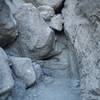 The rockfall appears to block the trail. However, by going to the left and scrambling through some boulders, you can get around it and continue up the canyon.