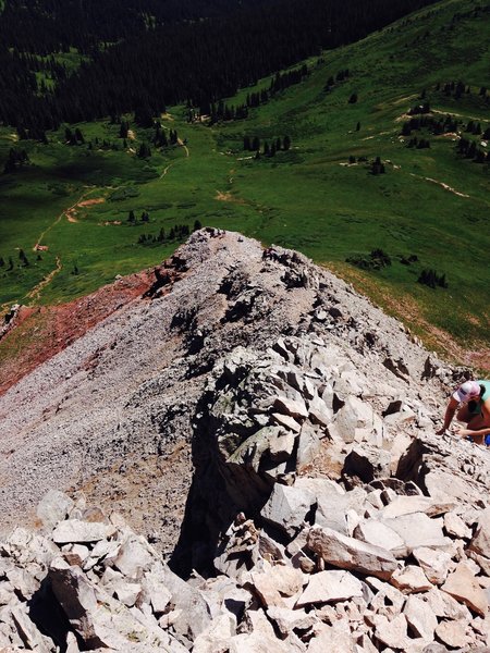 This is the type of scrambling you'll be doing on the way up and more importantly on the way down.  The flat spot with a few folks hanging out is the Eagle's Nest, a great spot for those who want a break or a turnaround point before the scrambling.