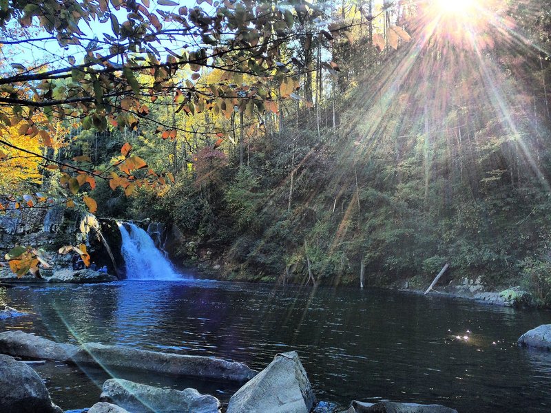 Sun shines on Abram Falls in the Great Smoky Mountains National Park.