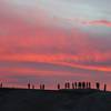 A large group enjoys a sunset.