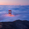 The Golden Gate Bridge shrouded in fog.