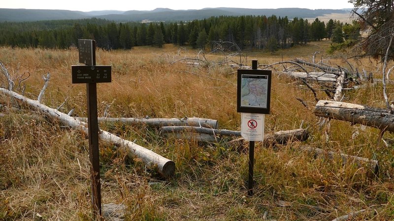 Trail closure sign for Sour Creek Trail, Wrangler Lake Trail, and north end of Howard Eaton: Fishing Bridge - Canyon Trail