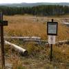 Trail closure sign for Sour Creek Trail, Wrangler Lake Trail, and north end of Howard Eaton: Fishing Bridge - Canyon Trail