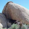 A large cave can be seen under the split rock at the trailhead.