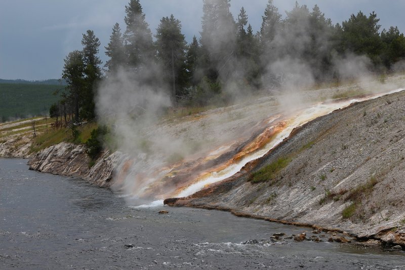 Scalding water flowing into Firehole River, Midway Geyser Basin.