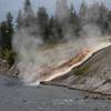 Scalding water flowing into Firehole River, Midway Geyser Basin.