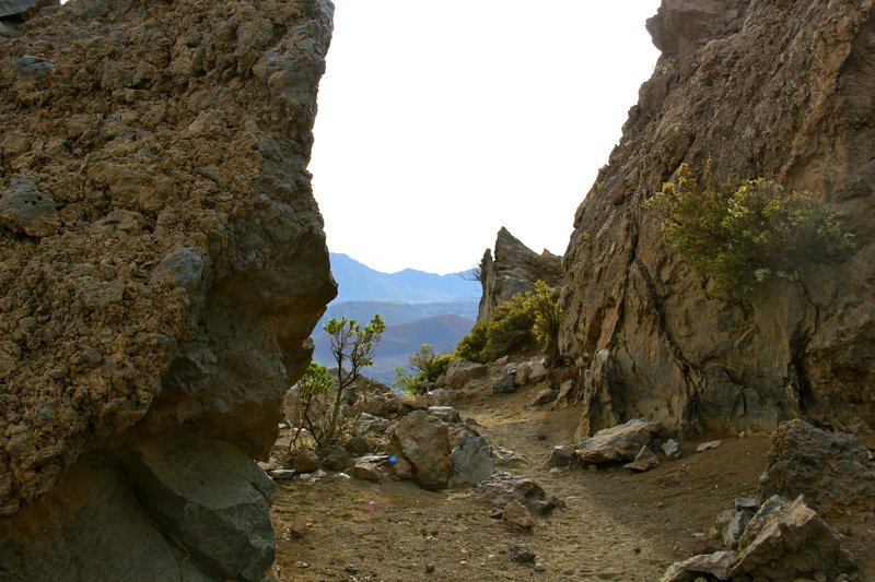 Walking between "Split Rocks" volcano rocks.