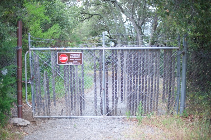 The trail dead ends at private property on the park boundary.