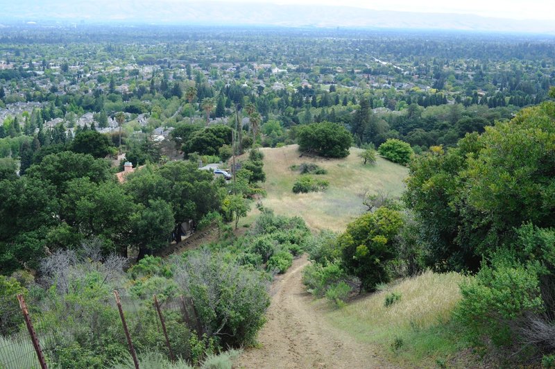 The trail descends a steep hill back toward civilization.