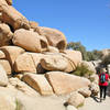 Walking through rock boulders.