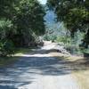 The trail as it descends from the gate by the dam.