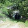 There is a tunnel, which ties into the dam and provides relief in high water, that sits off on the right side of the trail.