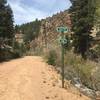 The trail eventually leaves the road at this sign. To access the trail go up to the power line in the background.